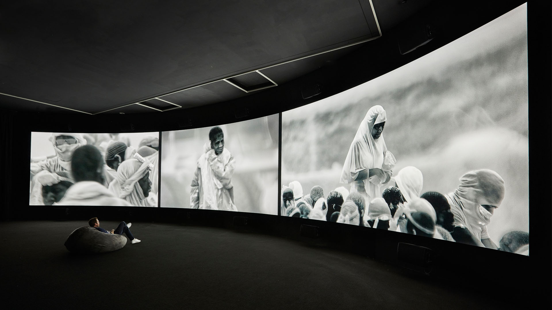 Richard Mosse <br /> <em>Incoming</em> 2015–16 <br /> Cinematographer / Editor: Trevor Tweeten<br /> Composer / Sound Designer: Ben Frost <br /> Installation view NGV Triennial 2017<br /> Co-commissioned by the National Gallery of Victoria, Melbourne and the Barbican Art Gallery, London<br /> National Gallery of Victoria, Melbourne <br /> Purchased with funds donated by Christopher Thomas AM and Cheryl Thomas, Jane and Stephen Hains, Vivien and Graham Knowles, Michael and Emily Tong and 2016 NGV Curatorial Tour donors, 2017<br /> © Richard Mosse<br /> Photo: Sean Fennessy