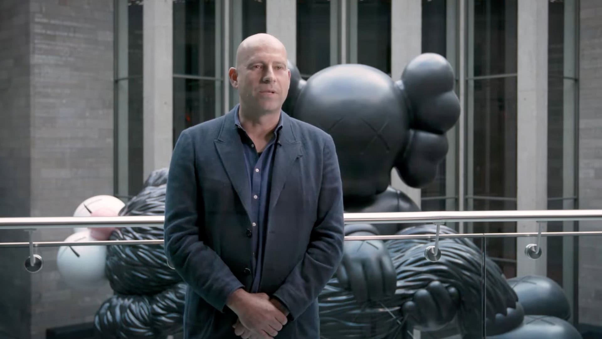 KAWS GONE at NGV with Head of Conservation, Michael Varcoe-Cocks